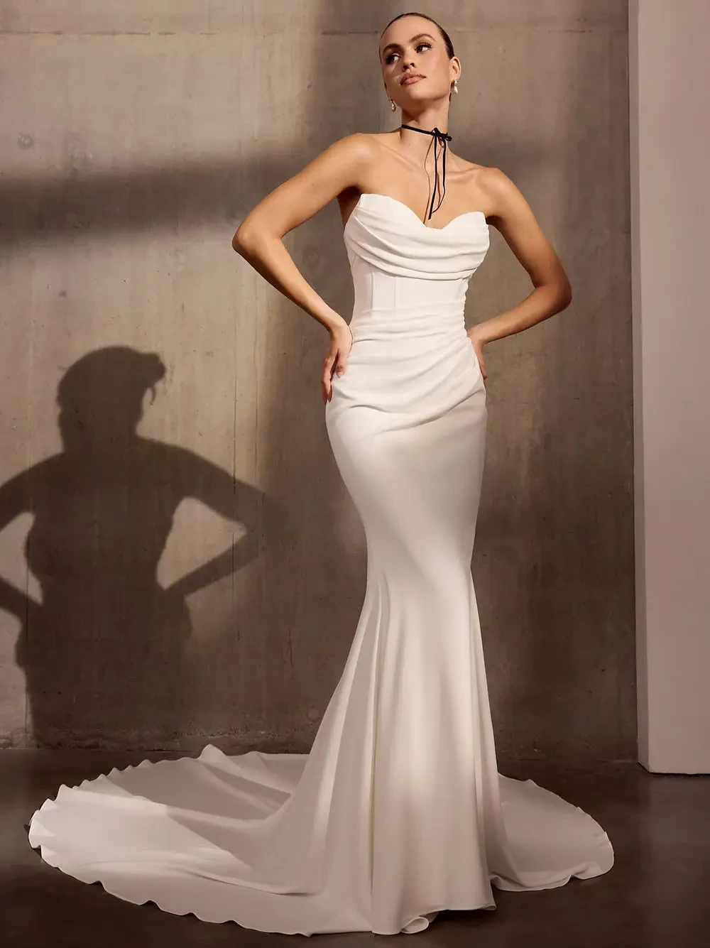 Model wearing a white Avenue by Josephine Scott Dress